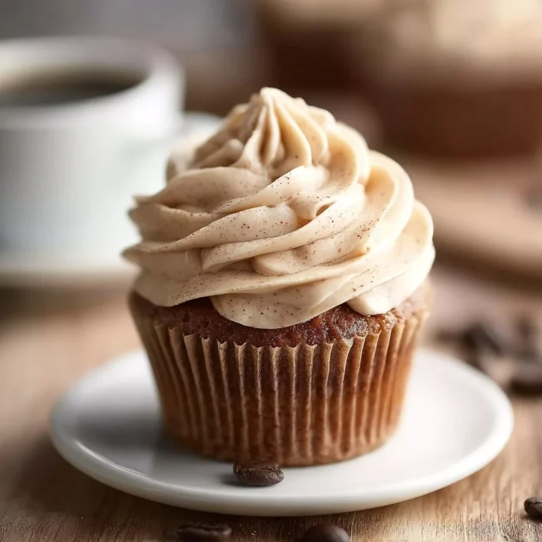 Delicious coffee buttercream frosting spread on a chocolate cupcake